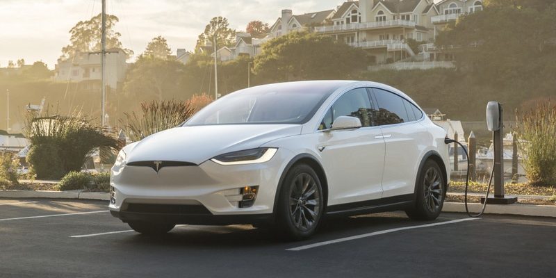 Tesla Model X charging near harbour front